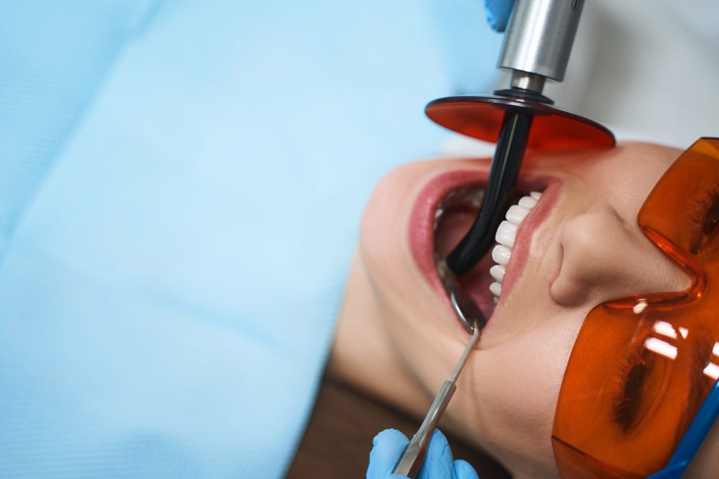 dentist operating on women teeth